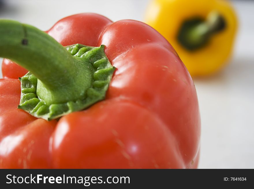 Close up of red and Yellow Pepper on Mable Background