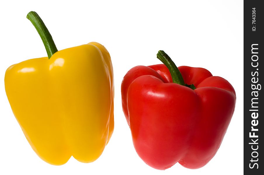 Two peppers, yellow and red, isolated