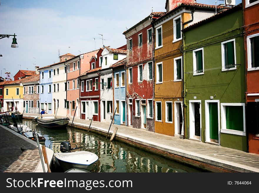 Boats in front of the colorful houses of Venice. Boats in front of the colorful houses of Venice