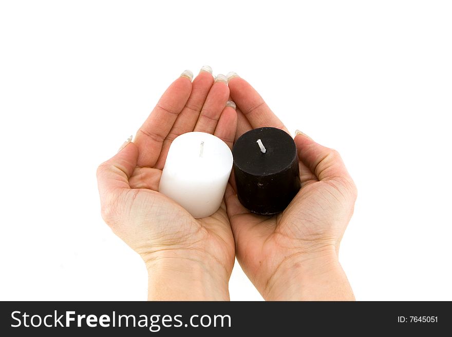 Two candles in hands on white background