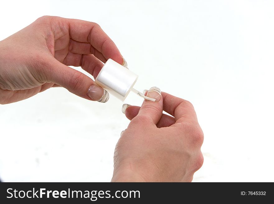 Polishing nails on a white background