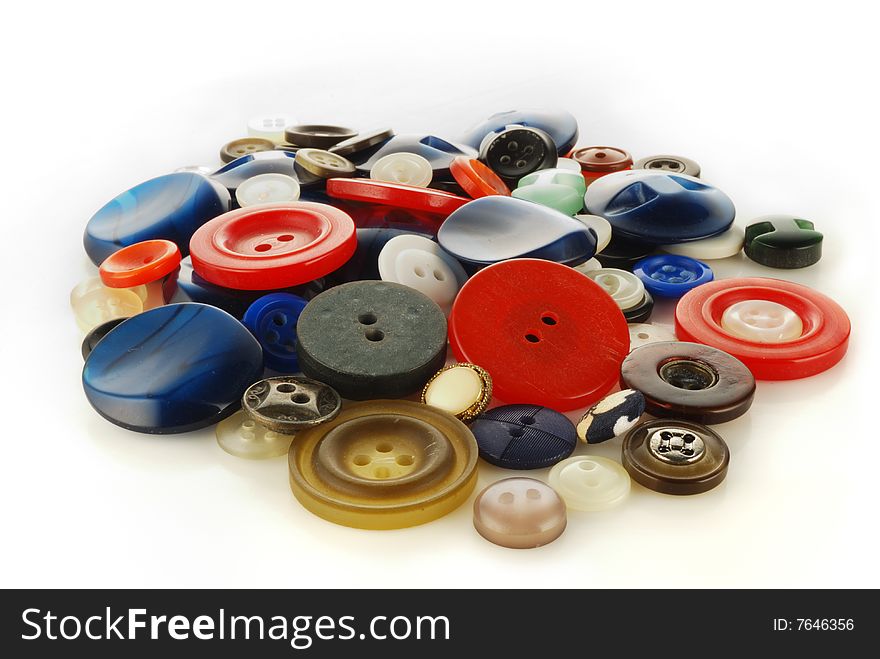 Heap (mineral deposit) of the buttons on a white background. Heap (mineral deposit) of the buttons on a white background