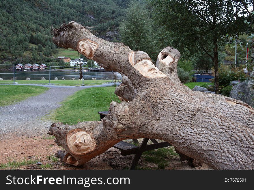 A nice sculpture of faces on tree in Norway. A nice sculpture of faces on tree in Norway