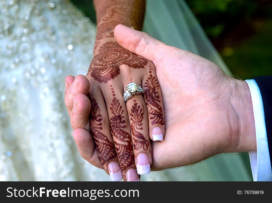 Bride and groom's hands with wedding rings. JUST MERRIED. Bride and groom's hands with wedding rings. JUST MERRIED