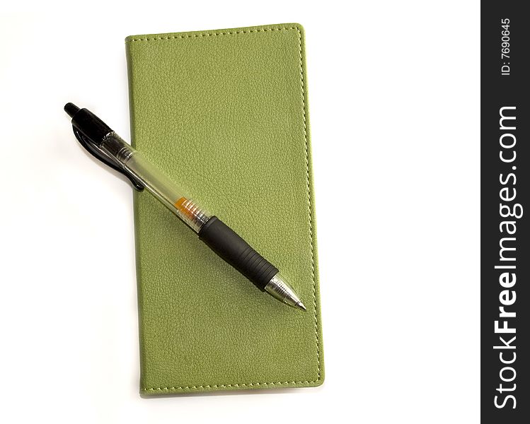 Green notebook notepad and pen. Green notebook notepad and pen