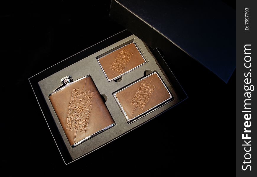 Flask and cases for cigarettes in a gift box