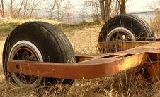Old Machinery Part With Two Wheels Abandoned In A Park, In Rural Royalty Free Stock Images Old Machinery Part With Two Wheels Abandoned In A Park, In Rural Royalty Free Stock Images