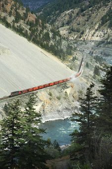 Freight Train Going Through Mountain Area Stock Photos