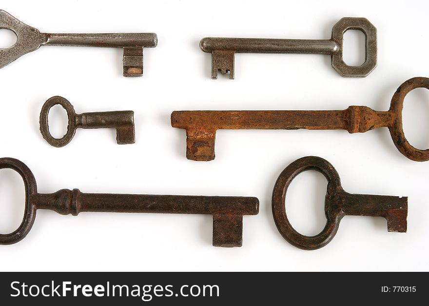 Old keys on white background