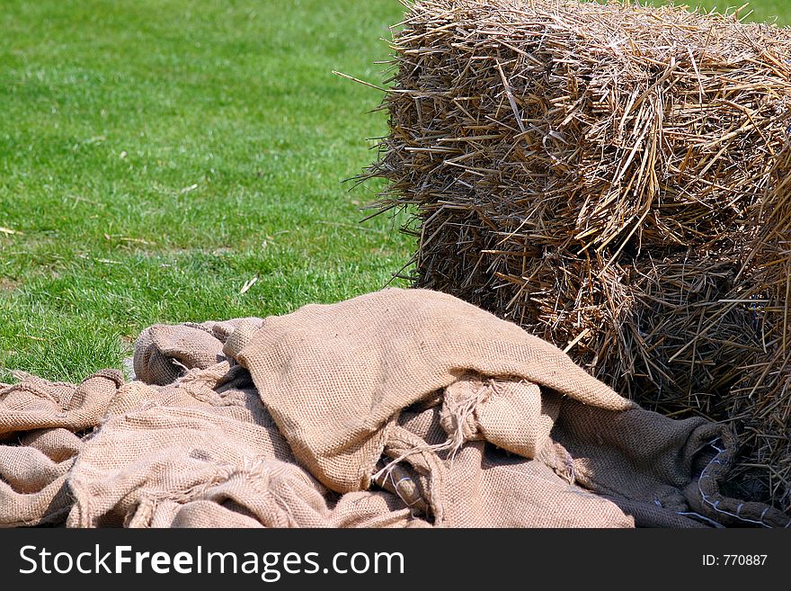 Hay stock and sack on the meadow on a sunny spring day. Hay stock and sack on the meadow on a sunny spring day