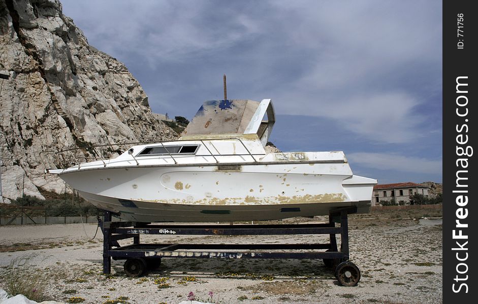 An old fishing boat out of the water in the iles du frioul off marseille, france. An old fishing boat out of the water in the iles du frioul off marseille, france