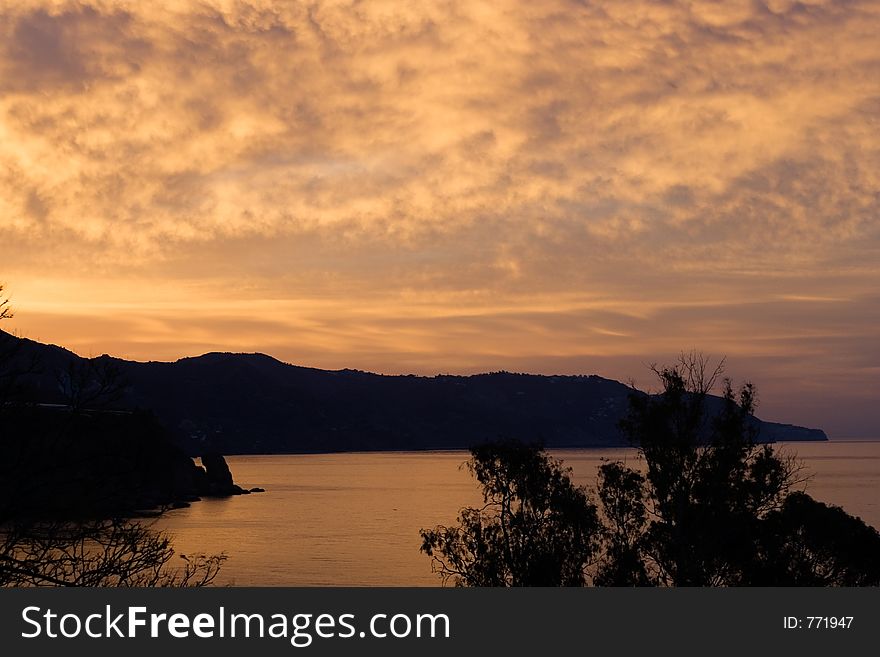 The sky boils in the early morning as the sun rises over Spain's Mediterannean coast. The sky boils in the early morning as the sun rises over Spain's Mediterannean coast