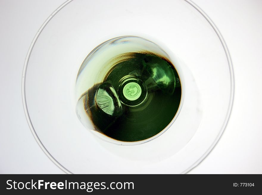 Green martini or appletini shot from above using lightbox. Green martini or appletini shot from above using lightbox.