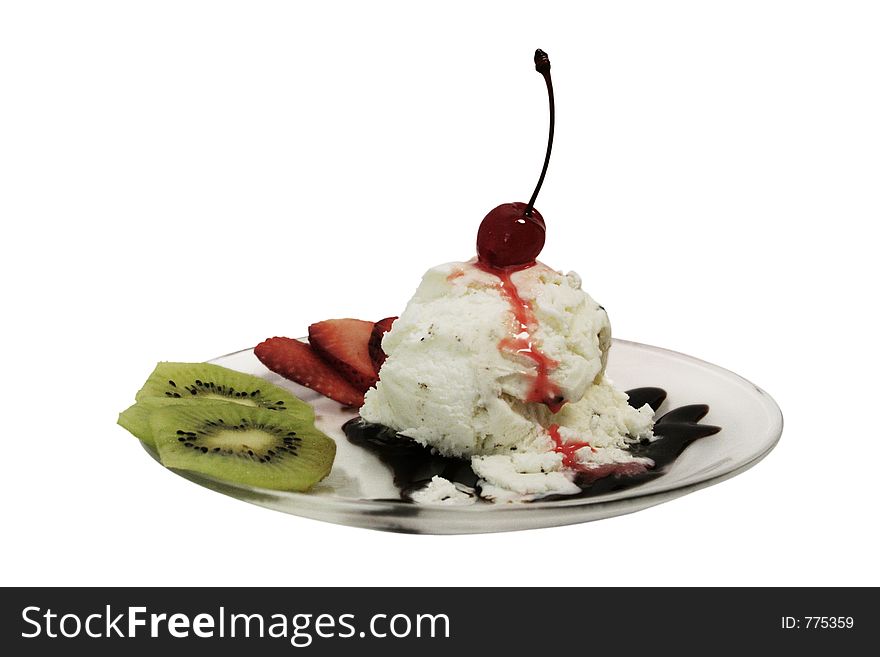 Ice cream desert with cherry on the top poured with syrup and chocolate decorated with sliced kiwi and strawberry. Ice cream desert with cherry on the top poured with syrup and chocolate decorated with sliced kiwi and strawberry