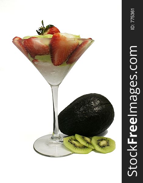 Avocado juice covered with sliced strawberry decorated with whole avocado and sliced kiwi. Avocado juice covered with sliced strawberry decorated with whole avocado and sliced kiwi