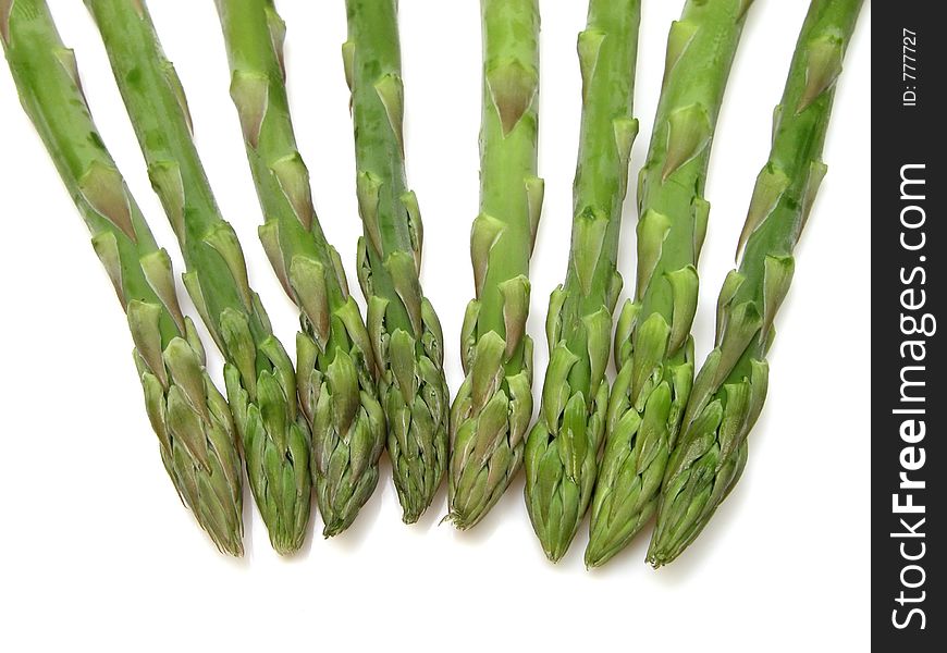 Asparagus over white background with small shadows. Asparagus over white background with small shadows.