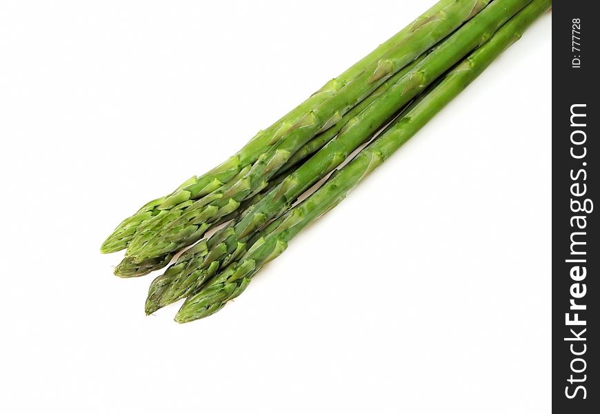 Asparagus bunch over white background