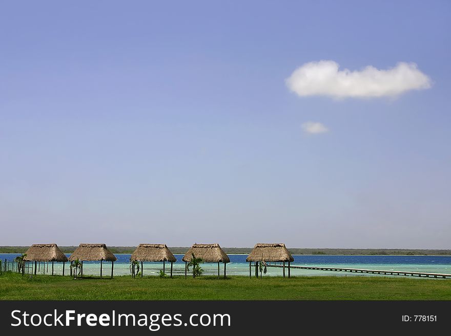 Palapas on the shores of Lake Bacalar, Quintana Roo, Mexico. Palapas on the shores of Lake Bacalar, Quintana Roo, Mexico