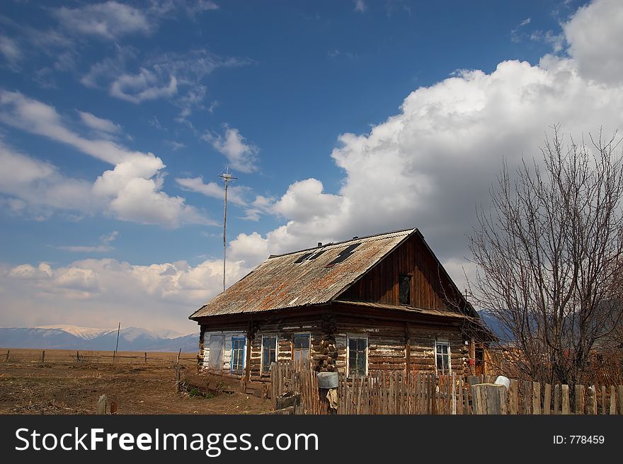 Old building and Clouds In The Sky. Altay, Russia.