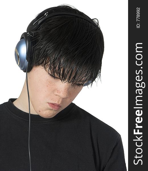 Isolated teen with expression listening to music. Isolated teen with expression listening to music