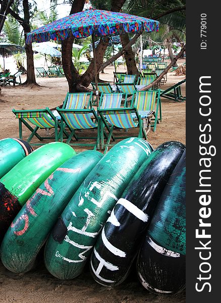 Beach tubes with beach umbrellas in the background. Beach tubes with beach umbrellas in the background