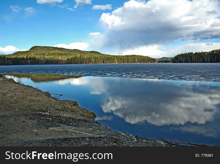 Beautiful lake in rural area BC. Reflection in water.