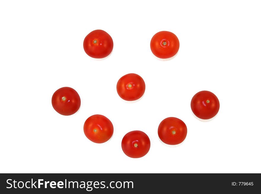 Smiley face made out of cherry tomatoes. Smiley face made out of cherry tomatoes