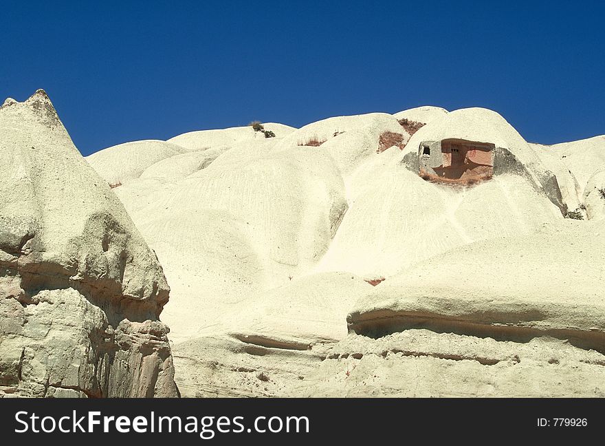 An ancient troglodyte home in a tuff hill, Cappadocia, Turkey. An ancient troglodyte home in a tuff hill, Cappadocia, Turkey