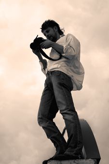 Stylish Looking Young Man With Camera Royalty Free Stock Images Stylish Looking Young Man With Camera Royalty Free Stock Images