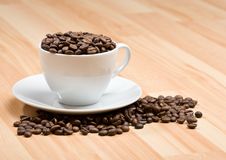 Cup With Freshly Roasted Coffee Beans On Floor Royalty Free Stock Photography Cup With Freshly Roasted Coffee Beans On Floor Royalty Free Stock Photography