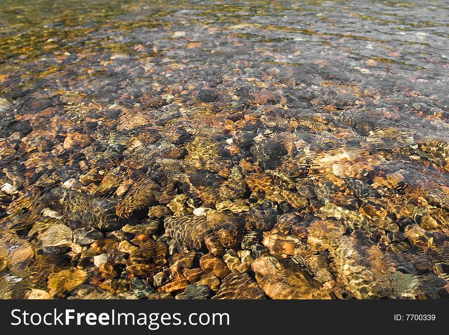 Pebbles in stream in mountain river