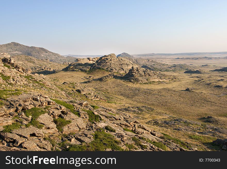 Mountain with rocks under blue sky. Mountain with rocks under blue sky