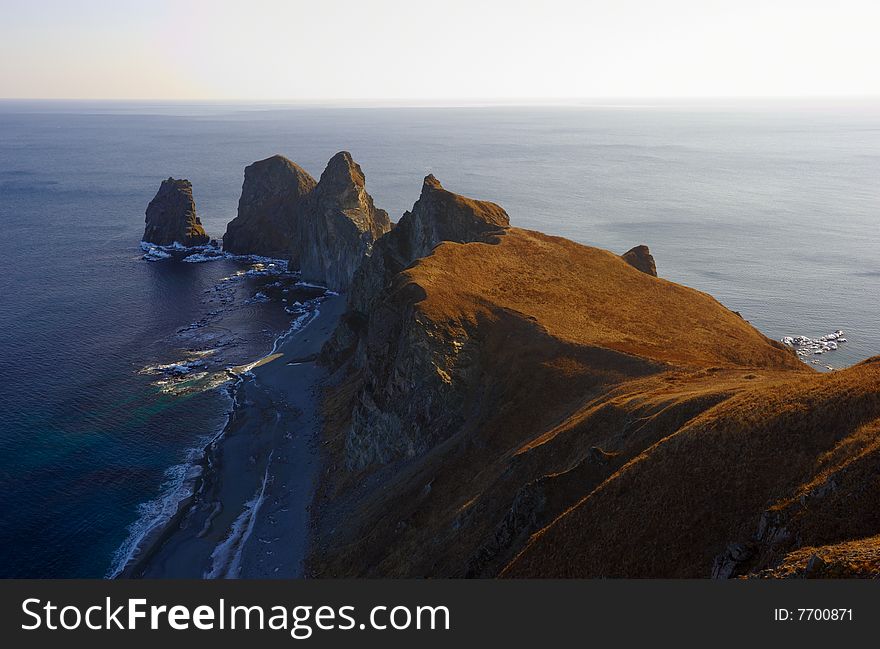 Sunset on cape of Four Rocks. The Far East. Russia. Sunset on cape of Four Rocks. The Far East. Russia.