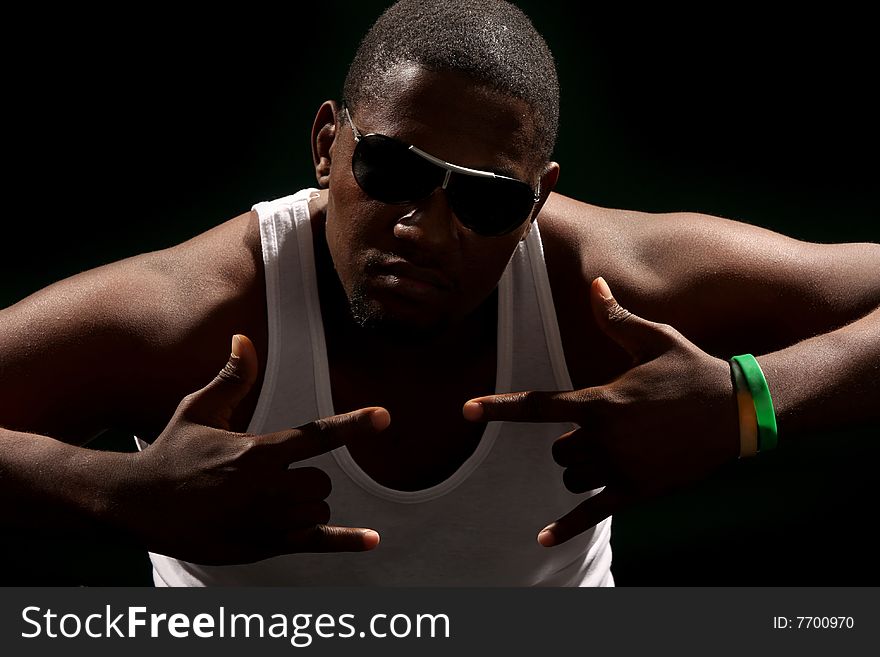 Young african american male on black background