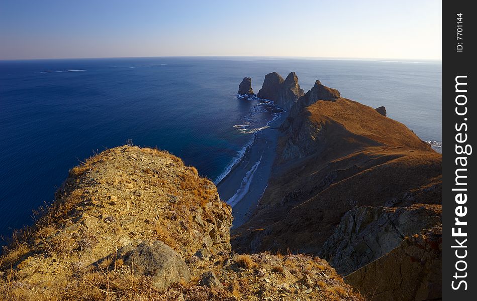 Sunset on cape of Four Rocks. The Far East. Russia. Sunset on cape of Four Rocks. The Far East. Russia.