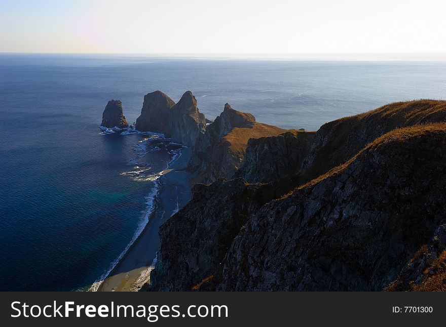 Sunset on cape of Four Rocks. The Far East. Russia. Sunset on cape of Four Rocks. The Far East. Russia.