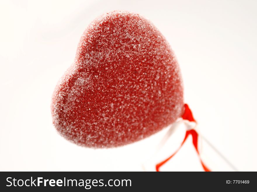 Candy heart on white background, close up