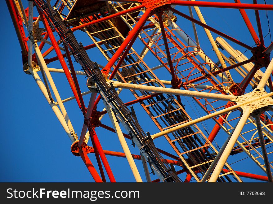 Telecommunication tower with stairs in the middle. Close up view. Telecommunication tower with stairs in the middle. Close up view.