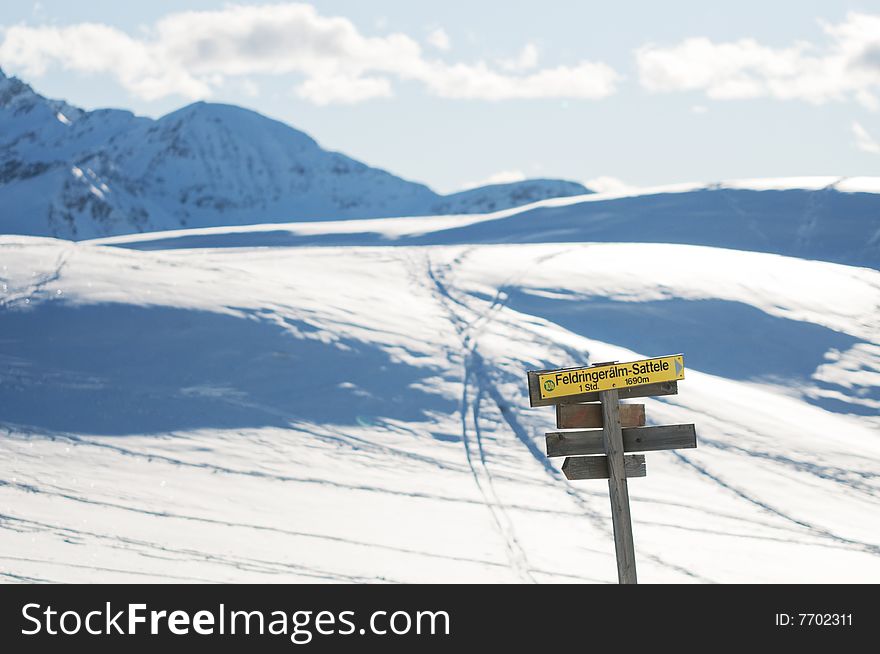 The signpost in the winter mountains