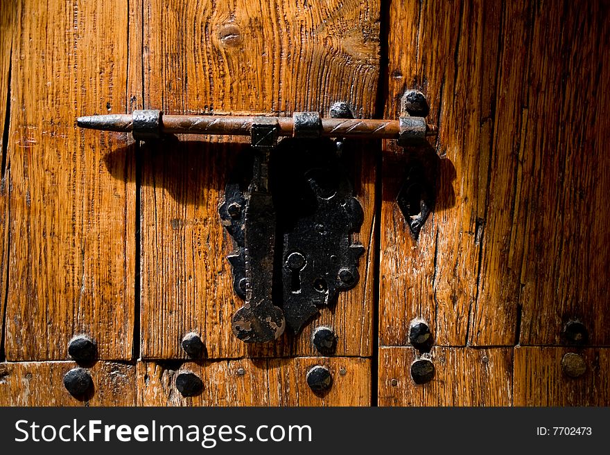 An old iron metal door handle knocker and locker. An old iron metal door handle knocker and locker