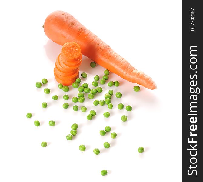 Whole carrot, stacked carrot slices and peas isolated on white background. Whole carrot, stacked carrot slices and peas isolated on white background