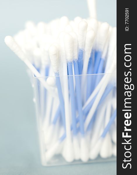 Cotton sticks isolated on a blue background