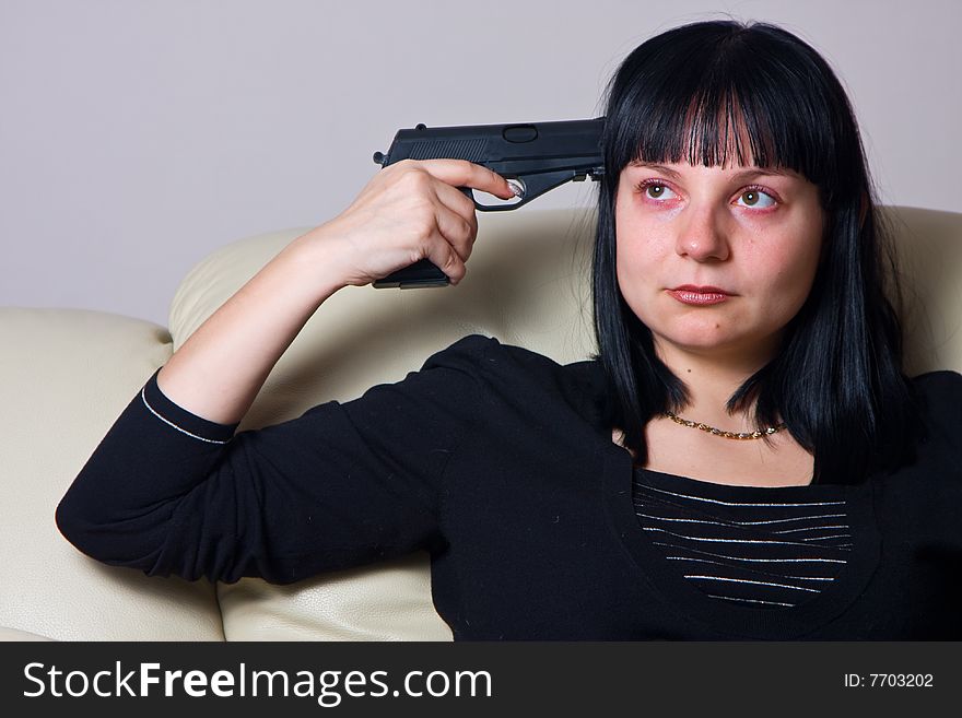 The  Girl Has Put A Pistol To A Temple.suicide.