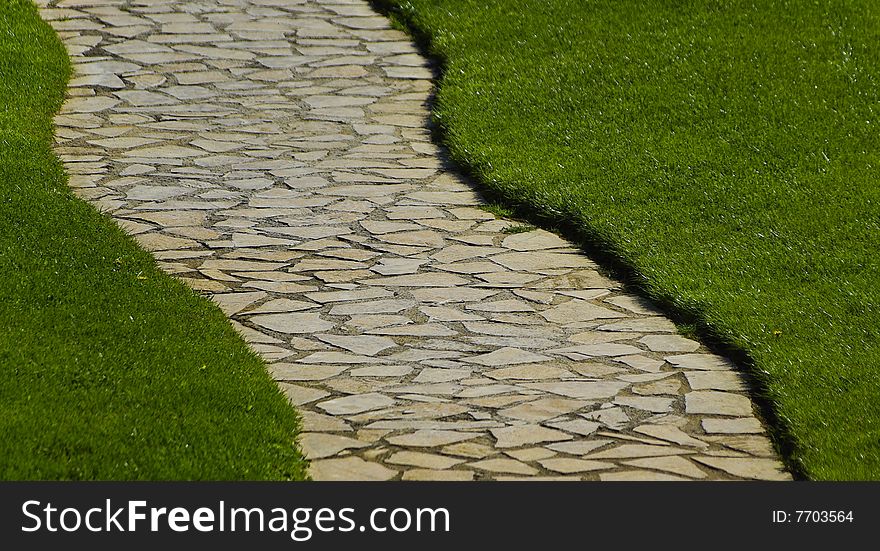 One step of natural stone and the side lawn. One step of natural stone and the side lawn