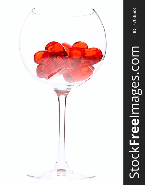 Red jelly hearts in wine glass