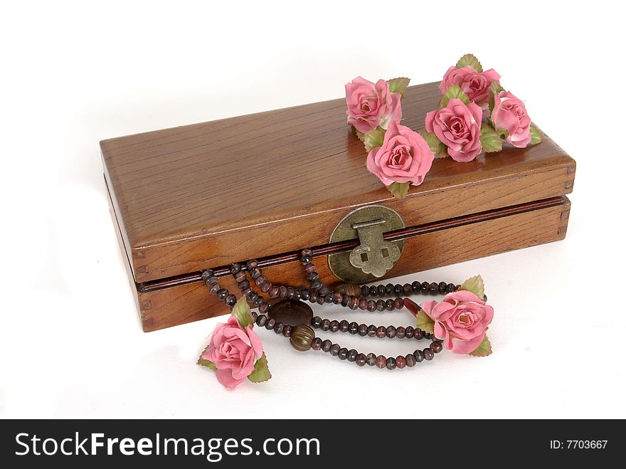 Wooden box with roses and necklace