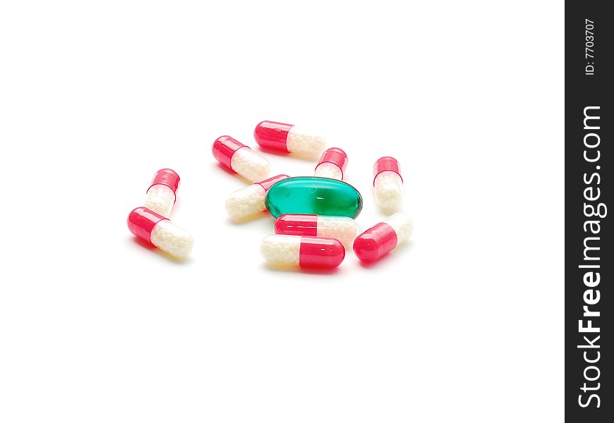Green pill between red pills