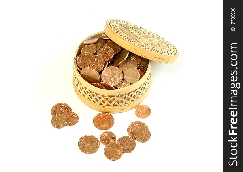 Carved wooden box full of coins, isolated on a white background