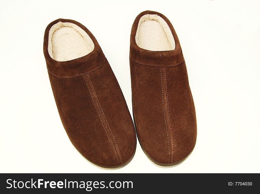 Isolated brown slippers on white background