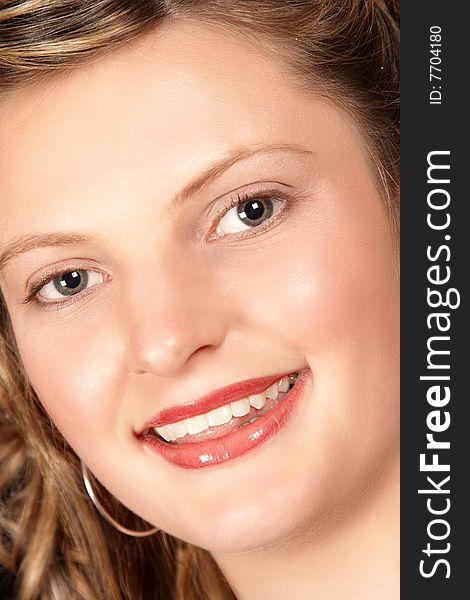 Radiant smile by young attractive model with red lips. Radiant smile by young attractive model with red lips